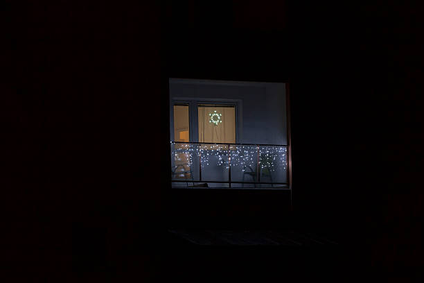 A beautiful window adorned with a Star of David is illuminated at night