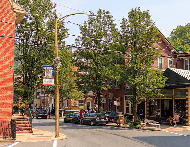 istock Quaint street corner with specialty shops on Broadway. Tourists exploring small-town retail district in Jim Thorpe, Pennsylvania. 2229123788