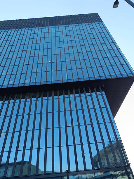 istock Modern Glass Office Buildings Against Clear Blue Sky 2229127216