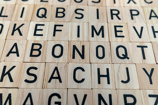background from alphabets on a wooden surface. The concept of thinking development, grammar.