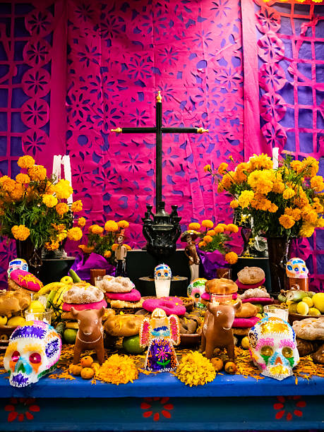 Day of the Dead altar, enriched with unique details, including clay figures of animals that symbolize the pets that guide the souls back home. The scene is complemented with the classic elements of the celebration: cempasúchil, pan de muerto, sugar skulls and candles, all in a composition full of joy, color and a deep cultural sense.
