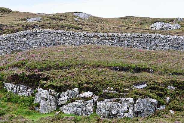 Natural gneiss rock outcrop and dry stone wall, Scalpay, The Outer Hebrides Western Isles