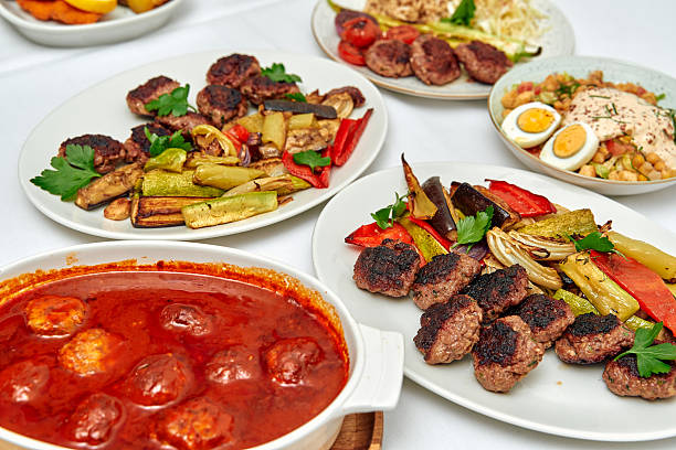 istock A Delightful Array of Grilled Meats, Vegetables, and Savory Dishes Showcased on a Dining Table, Perfect for Sharing and Enjoying with Family and Friends 2229130120