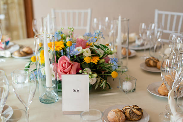 istock Elegant wedding reception table with floral centerpiece and candles 2229131654