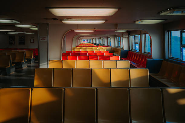 Passenger deck of the Staten Island Ferry after de-boarding with rows of empty, retro seats