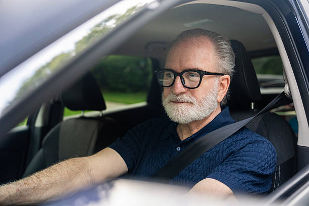 istock Senior man driving his car. 2229135815