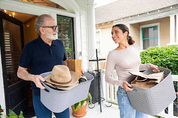 istock Senior man getting help from his adult daughter while moving boxes at home. 2229135835