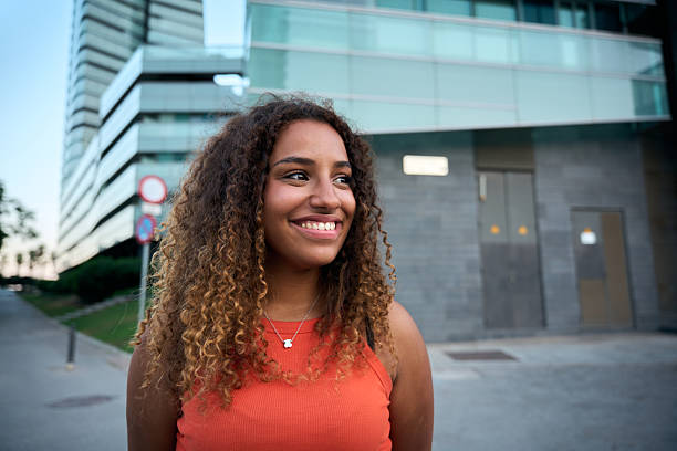 istock Authentic young woman smiling with joy and confidence in urban setting 2229138467