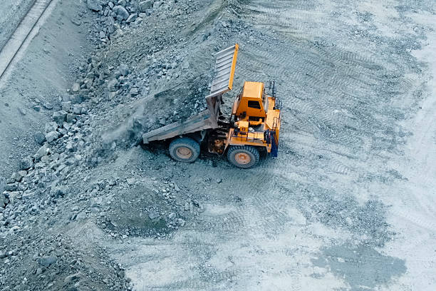 istock dump truck pours out crushed stone near the railway for subseque 2229141288