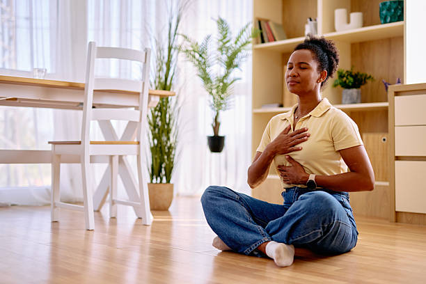 istock Serene woman practicing mindfulness meditation at home 2229142643