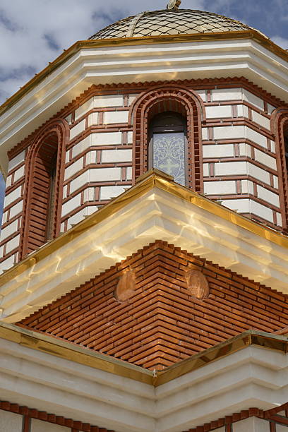 istock Golden-Domed Orthodox Chapel in Serene Monastery Courtyard in Bulgaria 2229153237