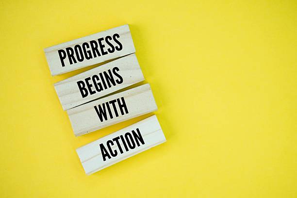 istock Inspirational and motivational words or quotes for success Progress begins with action 2229157319