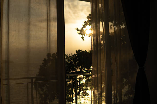 istock Golden Glow Through the Curtains 2229164882