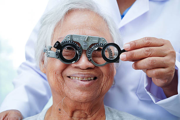 istock Optometrist checking Asian elderly woman ophthalmic vision eye test and using optical trial frame. 2229167434