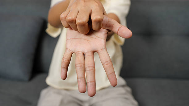 istock Person is extending their hand forward, showcasing their fingers and palm. background is soft gray, creating calm atmosphere. gesture may symbolize openness or communication 2229174180