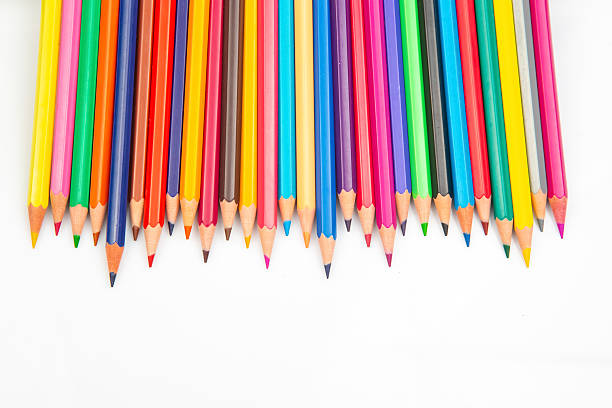 istock A vibrant row of sharpened colored pencils in various hues against a white background. Perfect for art supplies, creativity, and back-to-school themes. 2229175406