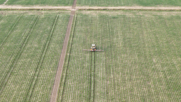 istock High Altitude Drone View Captures Agricultural Field Preparation with Precision Crop Spraying Equipment Ensuring Healthy Growth and Yield Maximization 2229175765