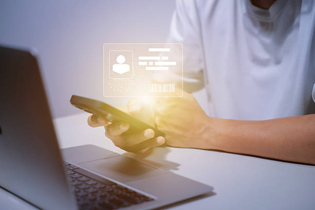 istock Digital identification or digital ID. Businessman and hand touch virtual screen of digital identification card to accessing databases by digital identity for cyber security. Employee badge. 2229179931