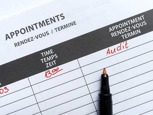 Black Marker On Appointments planner. audit written on date with red marker. Audit Appointment on Scheduling Document