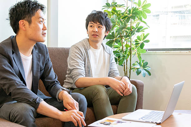 istock Japanese Men Having a Meeting at a Computer 2229182360