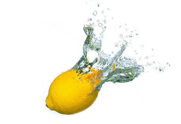 Fresh Lemon Splashing into Clear Water with Dynamic Motion