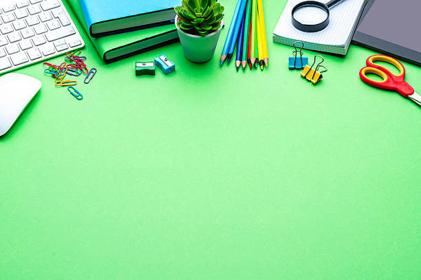 istock Stationary, school or office supplies border with copy space. Computer keyboard and digital tablet. Blue background, working or studying concept 2229184149