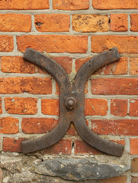 istock Iron Anchor Plate Cross-Shaped on Facade 2229184828