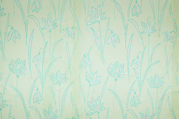 Old wallpaper on the wall. Old wallpaper for texture or background.