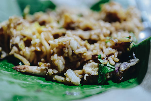 Delightful Culinary Experience: A Close-Up View of Exotic Fried Rice Served on a Leaf
