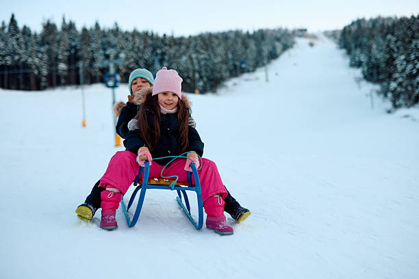 Joyful little girl plays with snow, joy, happiness, holiday