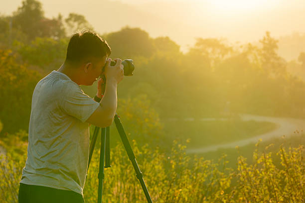 istock Landscape photographer capturing nature during golden hour evening light 2229193078
