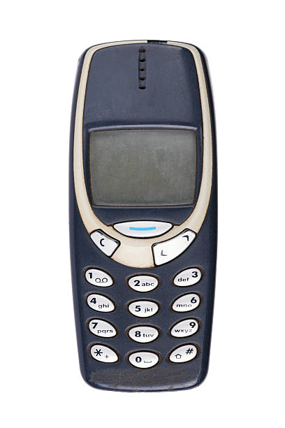 Classic mobile phone from the early 2000s with simple design isolated on white background.