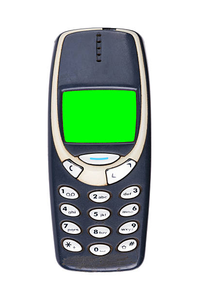istock Classic mobile phone from the early 2000s with green screen isolated on white background. 2229193828