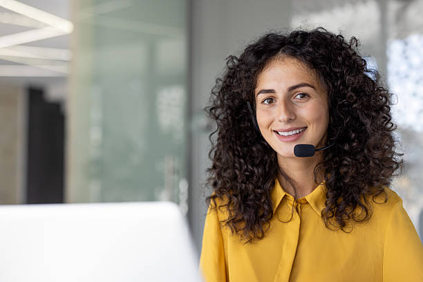 istock Cheerful customer service agent with a headset, ready to assist and help clients. 2229195553