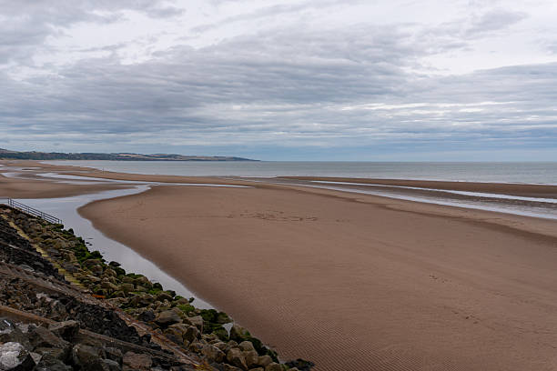 istock Grey clouds over the expansive beach at Montrose in Angus, Scotland 2229199091