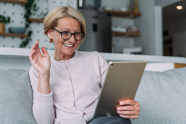 istock Cheerful woman having video call at home. 2229200374