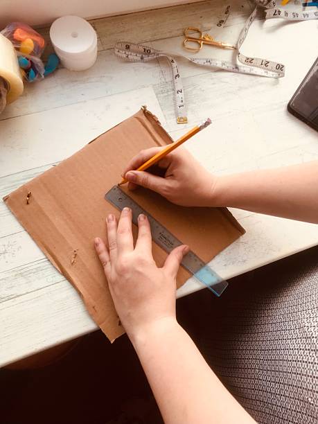 istock Creating a craft project with ruler and pencil in home workspace 2229200779