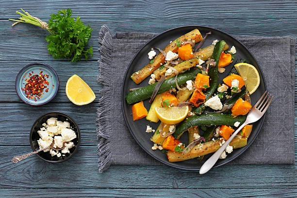istock roasted vegetable salad with goat cheese on plate 2229202583