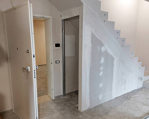 istock Covering staircase with plasterboard panels in a modern apartment 2229208965