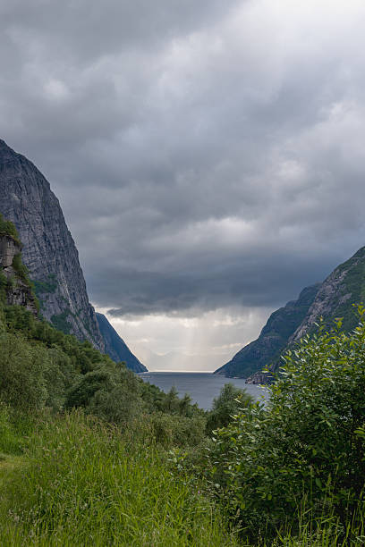 istock Towering Cliffs and Serene Fjord in Lysebotn, Norway 2229211754