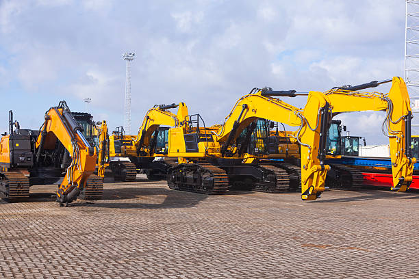 istock New yellow crawler excavators are parked on the site. 2229217978