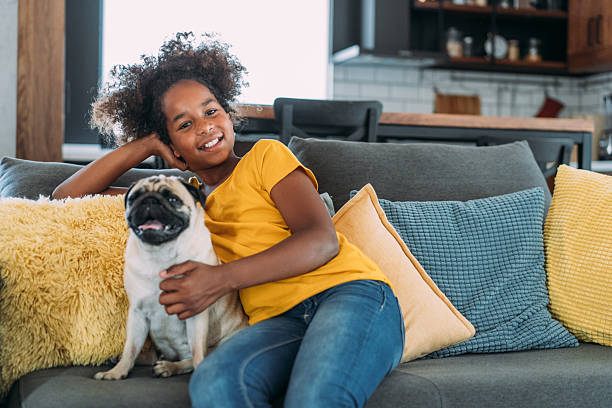 istock Girl and a dog at home. 2229220929