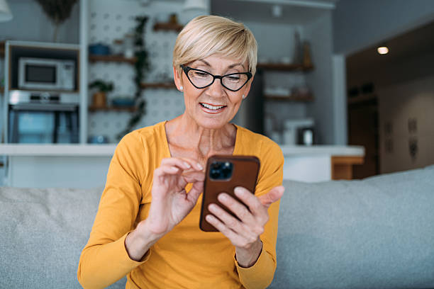 istock Woman using smartphone at home. 2229220993