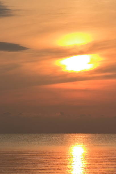 istock Sunrise over the sea, morning clouds 2229224742