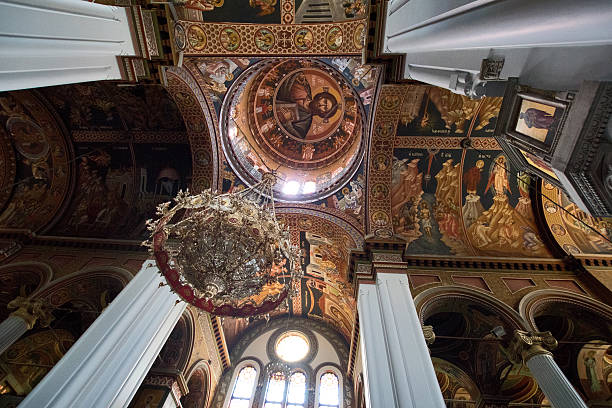 Istanbul, Turkey - September 1, 2025: Ceiling detail inside the Virgin Mary Greek Orthodox Church in Beyoğlu on Istiklal Avenue. The painted cross with Greek inscriptions is part of the church’s historic decoration and Orthodox Christian symbolism