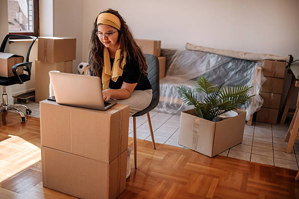 istock People moving in new apartment and using wireless technology 2229229757