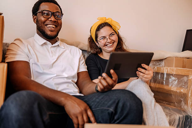 istock People moving in new apartment and using wireless technology 2229229992