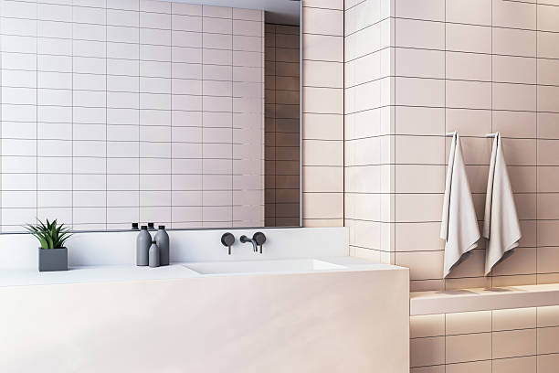 istock Modern luxury bathroom interior with clean white sink, wall mirror, soft lighting, and minimalist decor in a spacious and upscale setting. 3D Rendering 2229232877
