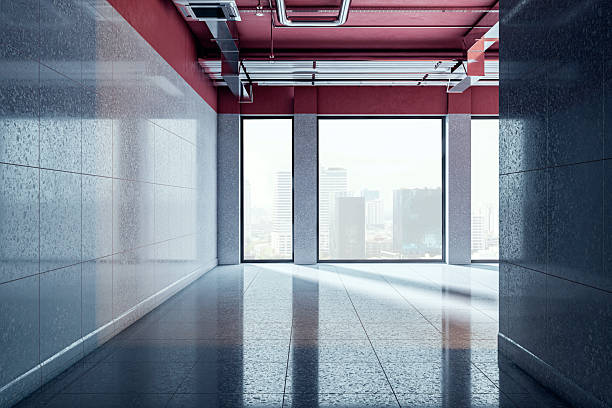 istock Modern empty hallway with tiled walls and large windows overlooking cityscape in corporate building interior design concept. 3D Rendering 2229232976