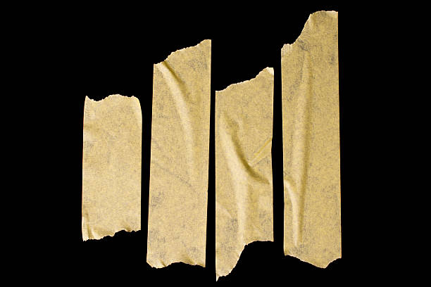 istock Pieces of masking tape on a black background. 2229238379